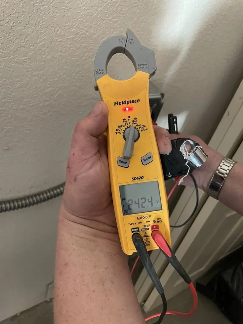 Voltage testing with clamp meter during Electrical Installation Services in Manhattan